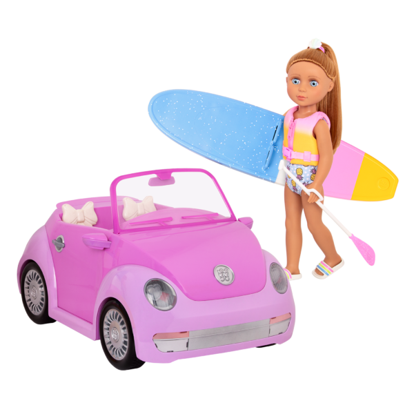 14-inch posable doll with light brown hair and blue eyes holding paddleboard next to toy punch buggy