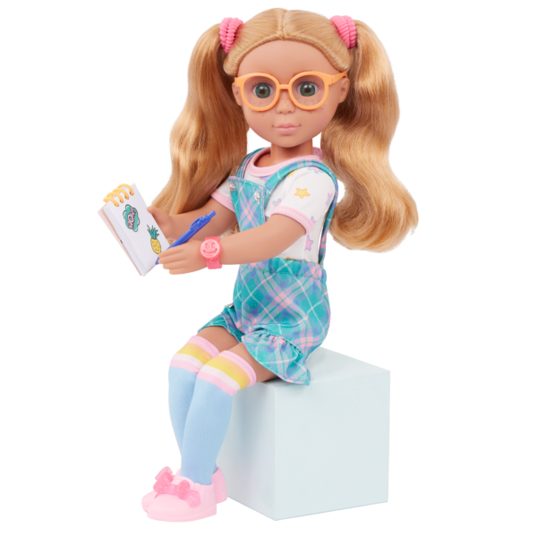 Liddy doll sitting with notepad