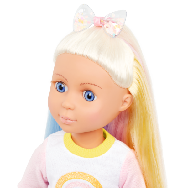 doll with blue eyes and blond hair with bow
