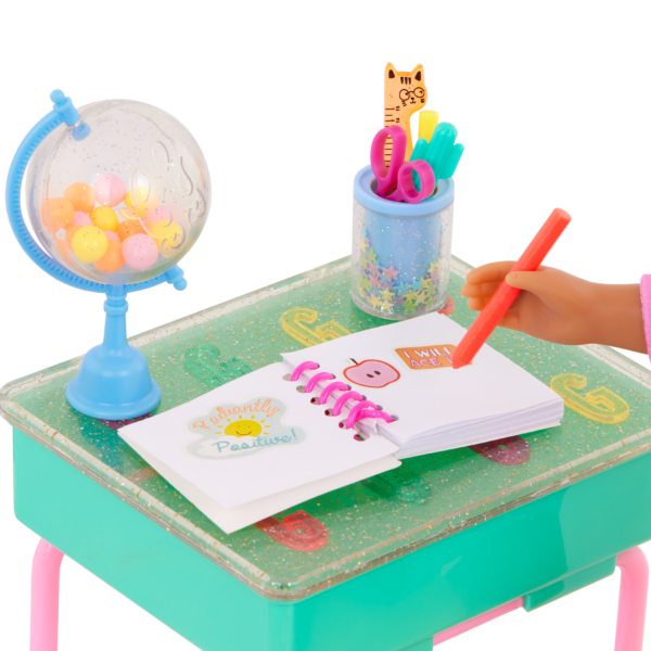 Fashion Doll Writing in Notebook on Toy Desk