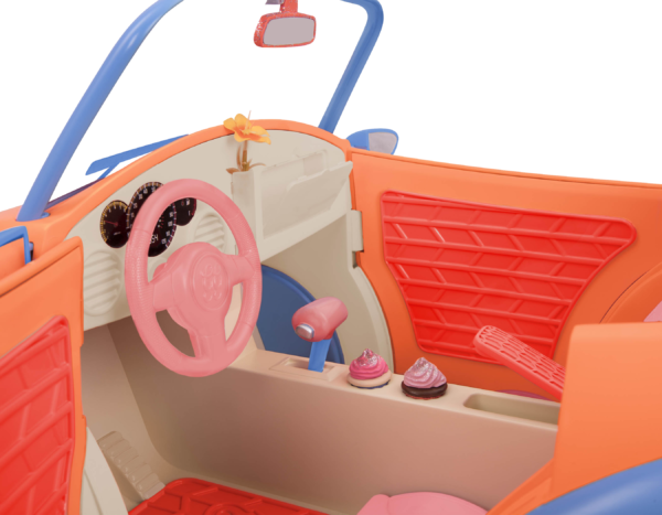 Driver's seat of orange and blue toy convertible punch buggy car