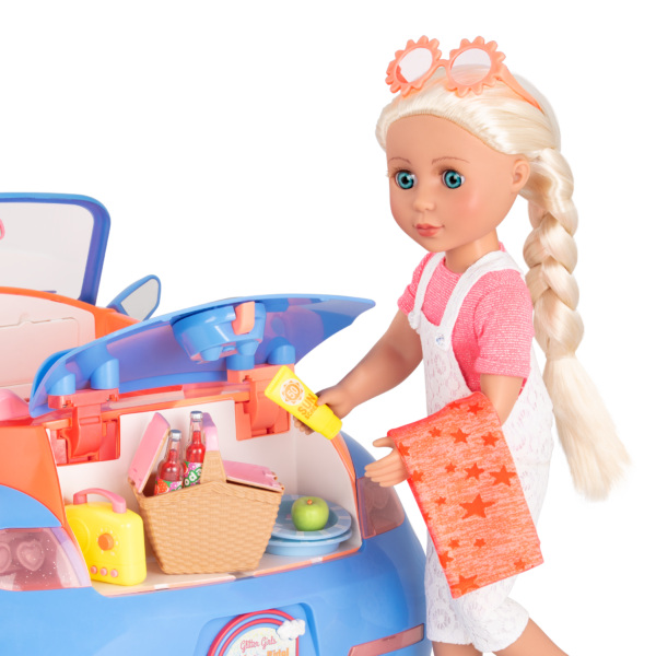 14-inch doll taking picnic playset out of toy punch buggy trunk