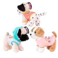 Three dog plushies wearing outfits