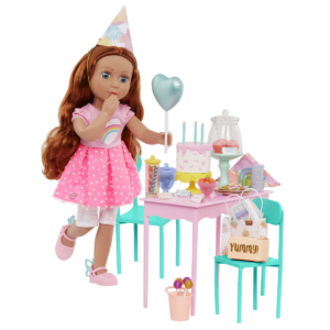 Doll at birthday table with cake and presents