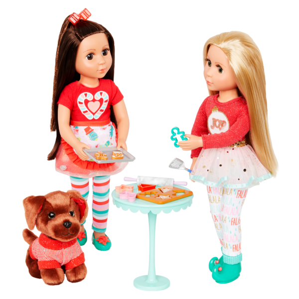 dolls round a table eating cookies