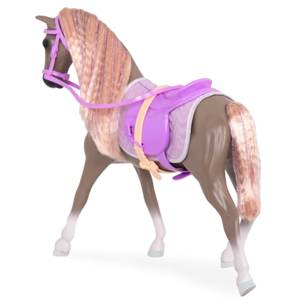 Light brown and peach horse with saddle